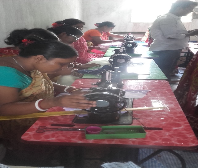 SHG women operating sewing machines in production unit