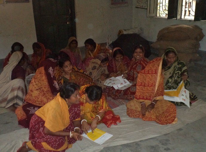Rural women engaged in adult literacy and booklet study circle